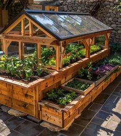 an outdoor garden area with raised wooden planters