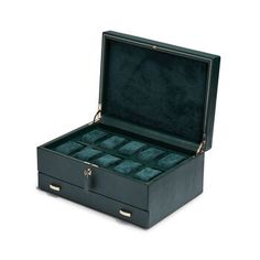 Wolf "British Racing" Green Faux Leather Ten-Module Watch Box, Storage Drawer. From Wolf, the "British Racing" green collection is a tribute to the illegal racing that took place in Ireland in the early 1900s. Made with vegan-friendly pebble-grained faux leather and sumptuous interior suede details. Protect your watches in style using this ten-module watch box with a storage drawer at the bottom. Measures 13"L x 9"W x 6"H. Item(s) are safely and securely packaged. Luxury Green Watch For Business, Green Rectangular Watches For Formal Occasions, Elegant Green Rectangular Watch, Elegant Green Rectangular Watches, Classic Formal Box Watch Accessories, Classic Formal Watch Accessories With Gift Box, Timeless Green Watch Accessories For Business, Elegant Green Business Watch, British Racing Green