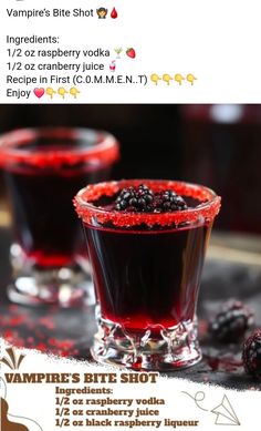 two glasses filled with red liquid and blackberries next to each other on a table