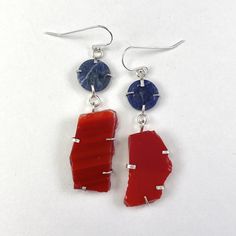 Silver & Stone Earrings - These earrings showcase sodalite lapis alongside red glass, all set in a sterling silver frame. The design combines these elements for a balanced and distinctive look. Silver Earrings With Lab-created Ruby In Fine Jewelry Style, Exquisite Sterling Silver Multi-stone Earrings, Nickel-free Red Southwestern Earrings, Blue Multi-stone Sterling Silver Earrings, Nickel-free Lapis Lazuli Dangle Earrings, Artful Home, Red Glass, Silver Frame, Stone Earrings