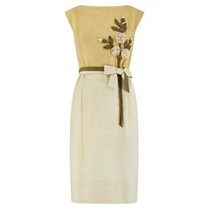 Designed by Jane Frye, this pretty sleeveless dress is almost certainly an early 1960s piece. It is crafted from soft, lightly textured silk or a silk blend in three complementary hues of green and adorned with sculptural appliqué of roses, buds, leaves and vines. A two-toned belt encircles the waist and is clipped onto a large bow at the front with an adjustable hook-and-eye clasp. The skirt is softly pleated at the waist and falls to the mid-calf. The whole dress is lined with pale chartreuse silk. A very high quality and wearable piece; the original label reads "Jane Frye - Minocqua” - an area of Wisconsin, USA. I absolutely love design and like to think that it was inspired by the Christian Dior dress that Elizabeth Taylor wore to the 1961 Oscars where she won for her performance as a Pale Chartreuse, Silk Green Dress, Rio Party, Christian Dior Dress, Green Silk Dresses, Black Cotton Dresses, Blue Sequin Dress, Dior Dress, Velvet Cocktail Dress