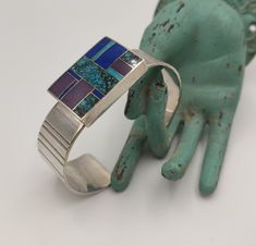 All sterling jewelry includes a complimentary cleaning & polishing cloth. Offered is a very rare and one of a kind vintage genuine SIGNED Ray Tracey Navajo cuff bracelet  This stunning piece of wearable art was acquired from the estate of a prominent Santa Fe collector. Modern composition of turquoise and lapis lazuli tile style focal set in a rectangular bezel. The cuff band is asymmetrical and grooved. A truly vintage & retired rare find! Gently adjustable 1.5" opening Quite substantial with a Vintage Navajo Jewelry, Navajo Jewelry, Native Jewelry, Sterling Jewelry, Style Tile, Vintage Navajo, Unisex Jewelry, American Jewelry, Native American Jewelry