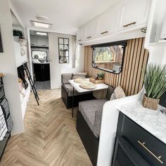 the interior of an rv is clean and ready to be used as a living area