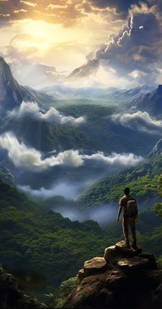 a man standing on top of a cliff looking at the clouds and mountains in the distance