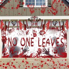 a house covered in blood with the words no one leaves on it