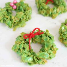 christmas wreath shaped cookies on a table