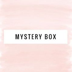 a pink box with the words mystery box written on it in black and white ink