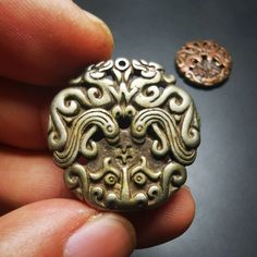 ❤This is collect from Tibet, a old badge or pandent, made of thokcha (Cold Iron from meteoric iron), carved with a Kirtimukha totem,vry delicate and rare. You can make it into a necklace, or a keychain, or just put it on your desk,as an ornament.  ❤Details Pendant material:thokcha  Pattern:Tibetan Kirtimukha Pendant size: 28mm x 28mm  ❤ABOUT Thokcha AMULET Thokcha (Tibetan: ཐོག་ལྕགས,  གནམ་ལྕགས) are tektites and meteorites which serve as amulets.Typically high in iron content, these are tradition