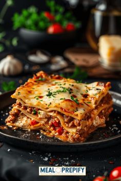 a close up of a plate of lasagna with meat and cheese on it