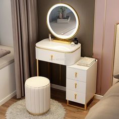 a white vanity table with a round mirror on it and a stool in front of it