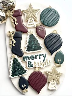 a plate with christmas cookies and decorations on it