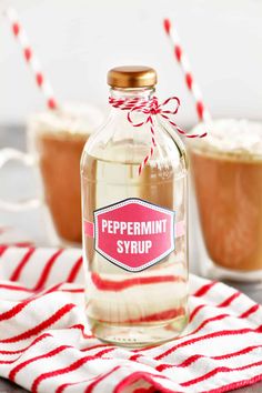 a bottle of peppermint syrup sitting on top of a red and white towel