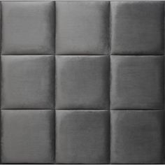 an upholstered headboard made out of grey fabric with squares on the back