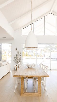 a large wooden table sitting in the middle of a room