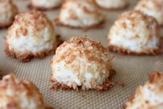 coconut macaroni and cheese balls are on a baking sheet, ready to be eaten