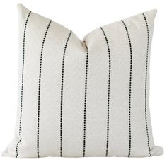 a black and white striped pillow on a white background, with lines drawn across it