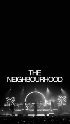 black and white photograph of people on stage at night with the words, the neighbourhood