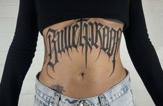 a woman with a tattoo on her stomach and the word'bullethead'written in black ink