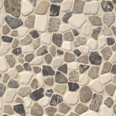 a white and brown mosaic tile with rocks on it