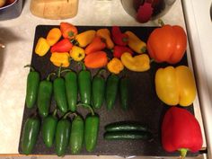 there are many different peppers on the counter