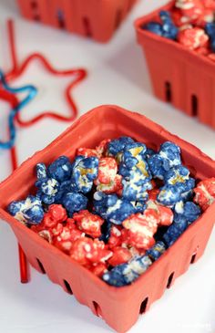 red, white and blue popcorn in plastic containers