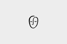 a drawing of a face with two eyes and one nose is drawn in black on a white background