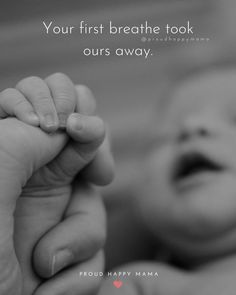 a black and white photo of a baby holding the hand of an adult's hand