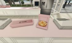 an image of a kitchen setting with pizza in the box and other items on the counter