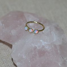 "Elegant 14k Solid Gold opal nose ring. This simple and beautiful piece of jewelry is perfect for a variety of outfits and occasions. The listing is for ONE hoop (not for a pair). The wire ends were rounded and polished to provide you with a smooth end for insertion. The earring was then polished. To open the ring gently twist the ends sideways, slip into the hole and then gently twist the ends back for a continuous hoop. You can find answers to most of your questions (like \"earrings size & Gold Opal Small Hoop Jewelry, Gold Hoop Opal Jewelry, Small Gold Opal Hoop Jewelry, Gold Opal Hoop Jewelry, Hypoallergenic Round Opal Jewelry, Dainty Nickel-free Small Hoop Rings, Opal Halo Jewelry With Round Shape, Round Opal Jewelry With Halo Detail, Halo Opal Jewelry With Round Shape