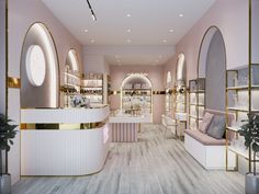 the interior of a store with pink walls and gold trim