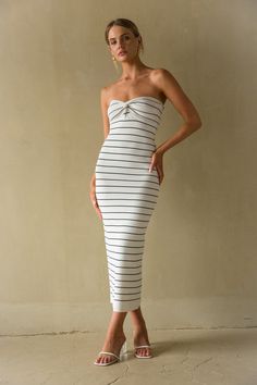 Let's go boating in the Jaclyn Strapless Twist Front Knit Midi Dress! This knit dress features a strapless sweetheart neckline, twist front detail, and classy striped pattern! Accessorize to complete the look!Details: 65% Acrylic, 35% Polyester Lots of stretch Dry clean only Elegant Strapless Bandeau Dress For Day Out, Elegant Bandeau Dress For Day Out, Fitted Bandeau Midi Dress For Brunch, Chic Strapless Dress With Sweetheart Neckline, Chic Bandeau Bodycon Midi Dress, Chic Bodycon Bandeau Midi Dress, Elegant Strapless Midi Dress For Day Out, Chic Strapless Dress With Sweetheart Neckline For Day Out, Fitted Midi Strapless Dress For Day Out