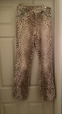 Fabulous vintage BLUMARINE leopard print jeans. Made in Italy of a cotton/spandex blend. Mint green/blue trim on outside seams and pocket seams. 5 pockets in total. Zipper and one button fly. Have room for stretch. Straight leg. Works well with this season's vintage style of the higher waistline.  Super comfortable. European size 40 - about a 6-8  In very good vintage condition. Waist - 29 Length - 32 inseam  40 " from outer top of waist to bottom of leg Leg opening - 17 1/2 Vintage Blumarine, Leopard Print Jeans, Italian Luxury Brands, Vintage Leopard, Y2k Pants, Print Jeans, Leg Work, Blue Trim, Printed Jeans