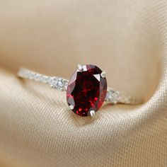 Beautifully handmade Garnet ring. The perfect cocktail ring set with a red gemstone and simulant diamonds Elegant, classy and vintage inspired. Available in Gold plating, Rose Gold plating and in Sterling Silver ☆ WHY THIS PIECE OF J E W E L R Y IS AWESOME! ☆ * Hand finished and made from high quality raw materials. * Long lasting beauty & Timeless design * Beautifully made, hand finished, Fast shipping with tracking amazing after sales service if needed. * Garnet oval cut 8x6 mm 1.25 ctw wi