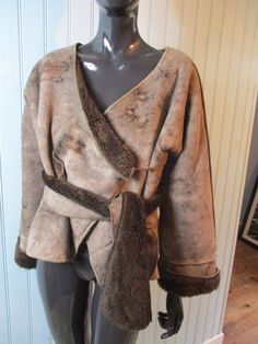 Vintage jacket. Faux suede with faux fur lining. Light brown with chocolate brown lining. Has two pockets and one clasp to close. Has a belt/scarf to make a wrap around. Dimensions: Chest: 40 Inches. Length: 20 Inches. Sleeve: 19 Inches. Made in France synthetic Vintage Brown Distressed Outerwear, Vintage Washed Brown Outerwear, Belt Scarf, Brown Vintage Fur Coat With Faux Fur Trim, Luxury Vintage Mink-colored Outerwear, Vintage Brown Faux Fur Outerwear, Tan Jacket, Boho Jacket, Vintage Jacket