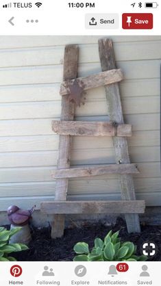 an old wooden ladder sitting in front of a house