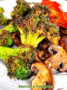 broccoli and mushrooms on a white plate