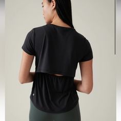 Athleta Nwt Air Out Cinch Tee Shirt Open Back Short Sleeve In Black Sizes S/M/L Brand New With Tags, Retail $59 49% Recycled Polyester/37% Tencel Modal/7% Spandex/7% Polyester Recycled Material: Made From Recycled Polyester, A Material Sourced From Post-Consumer Plastic Bottles That Helps Lessen Our Impact On The World Wicking: Pulls Sweat Away From The Body To The Surface Of The Fabric So It Can Evaporate Ionic+ Technology: Odor-Controlling Antimicrobial Silver Ions Knit In The Fabric Eliminate Camo Tee, Ladies Tee Shirts, Street Outfit, Black Shorts, Workout Tops, Plastic Bottles, Black Tee, Open Back, Short Sleeves Tops