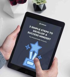 a person holding an ipad with the title 3 simple steps to developing a successful mindset