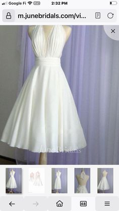 a white dress is displayed on a mannequin