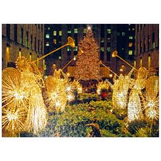 a large christmas tree surrounded by lights in the middle of a city