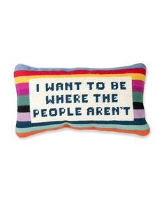 a colorful pillow with the words i want to be where the people aren't