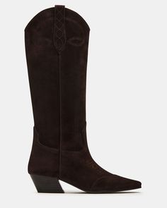 The DOLLIE Western boot offers a sleek and stylish design with a square toe. Experience comfort and durability with every step. Elevate your wardrobe with this timeless and versatile statement piece. 1.75 inch heel height Size 6 measurements: 15 inch shaft circumference, 13 inch shaft height Size 8 measurements: 16 inch shaft circumference, 14 inch shaft height Size 10 measurements: 17 inch shaft circumference, 14.75 inch shaft height Suede upper material Textile and synthetic lining Synthetic s