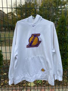 NIKE LAKERS NBA VINTAGE CENTR LOGO HOODIE SIZE XXL | eBay Nike White Hoodie For Sports Events, White Nike Hoodie For Sports Events, Hooded Tops With Team Logo For Streetwear, Throwback Streetwear Hoodie Top, Nike Casual Hoodie With Team Logo, Hooded Team Logo Top For Streetwear, Casual Streetwear Hoodie With Team Logo, Team Logo Hoodie Sweatshirt For Streetwear, Throwback Hoodie For Sports Events