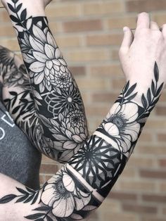 a person with some tattoos on their arms