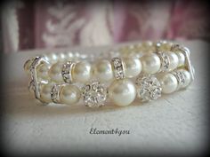 Bridal cuff bracelet Swarovski white or ivory by Element4you, $35.00 Elegant Adjustable Bridal Accessories For Bridal Shower, Cream Beaded Bracelets For Wedding With Round Beads, Cream Beaded Bracelets With Round Beads For Wedding, Cream Pearl Bracelet With Round Beads For Wedding, Pearl Drop Bracelet For Wedding, Wedding Bracelet With Pearl Drop, Cream Beaded Jewelry For Wedding, Cream Pearl Embellished Jewelry For Wedding, Cream Pearl-embellished Jewelry For Wedding