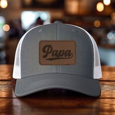 *Add some personality to your wardrobe with our leather patch hat design. *60% cotton/ 40% polyester, 100% polyester mesh backed trucker snapback cap, faux-leather laser engraved patch *Structured six-panel, mid-profile with pre-curved bill and adjustable plastic snapback closure *One size first most. Hat sizing: 7 - 7 3/4 inches, crown height approx 6 1/2 " *Faux-leather patches are engraved in the USA Adjustable Brown Hat With Letter Patch, Brown Curved Bill Hat With Letter Print, Brown Trucker Hat With Letter Patch And Curved Brim, Brown Snapback Hat With Letter Patch And Curved Brim, Outdoor Brown Snapback Hat With Letter Print, Brown Snapback Hat With Letter Patch, Brown Flat Bill Hat With Letter Patch, Brown Curved Brim Hat With Letter Patch, Father's Day Snapback Trucker Hat With Leather Patch