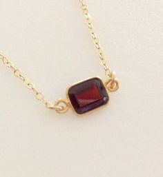 Gold Garnet Gemstone Jewelry, Gold Garnet Gemstone Necklace, Gold Garnet Jewelry With Bezel Setting, Gold Garnet Birthstone Jewelry, Gold Jewelry With Garnet Birthstone, Gold Garnet Jewelry With Birthstone, Classic Garnet Jewelry In Burgundy, Faceted Garnet Jewelry In Yellow Gold, Gold Garnet Birthstone Necklace