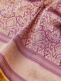 Experience the luxurious elegance of our Katan Silk Tanchoi Sarees, handcrafted with intricate Banarasi designs and premium Katan silk fabric. Available in a range of colors and styles, these sarees are the perfect choice for any special occasion Elegant Handloom Purple Pre-draped Saree, Elegant Purple Handloom Pre-draped Saree, Elegant Paithani Silk Pre-draped Saree For Traditional Ceremonies, Elegant Purple Jamawar Dupatta, Silk Shawl With Traditional Patterns And Drape, Silk Shawl With Traditional Patterns, Elegant Tussar Silk Shawl With Pallu, Elegant Jamawar Silk Scarf For Festive Occasions, Elegant Festive Jamawar Silk Scarf