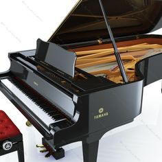 a grand piano and stool are shown in this image