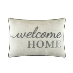 a welcome home pillow on a white background